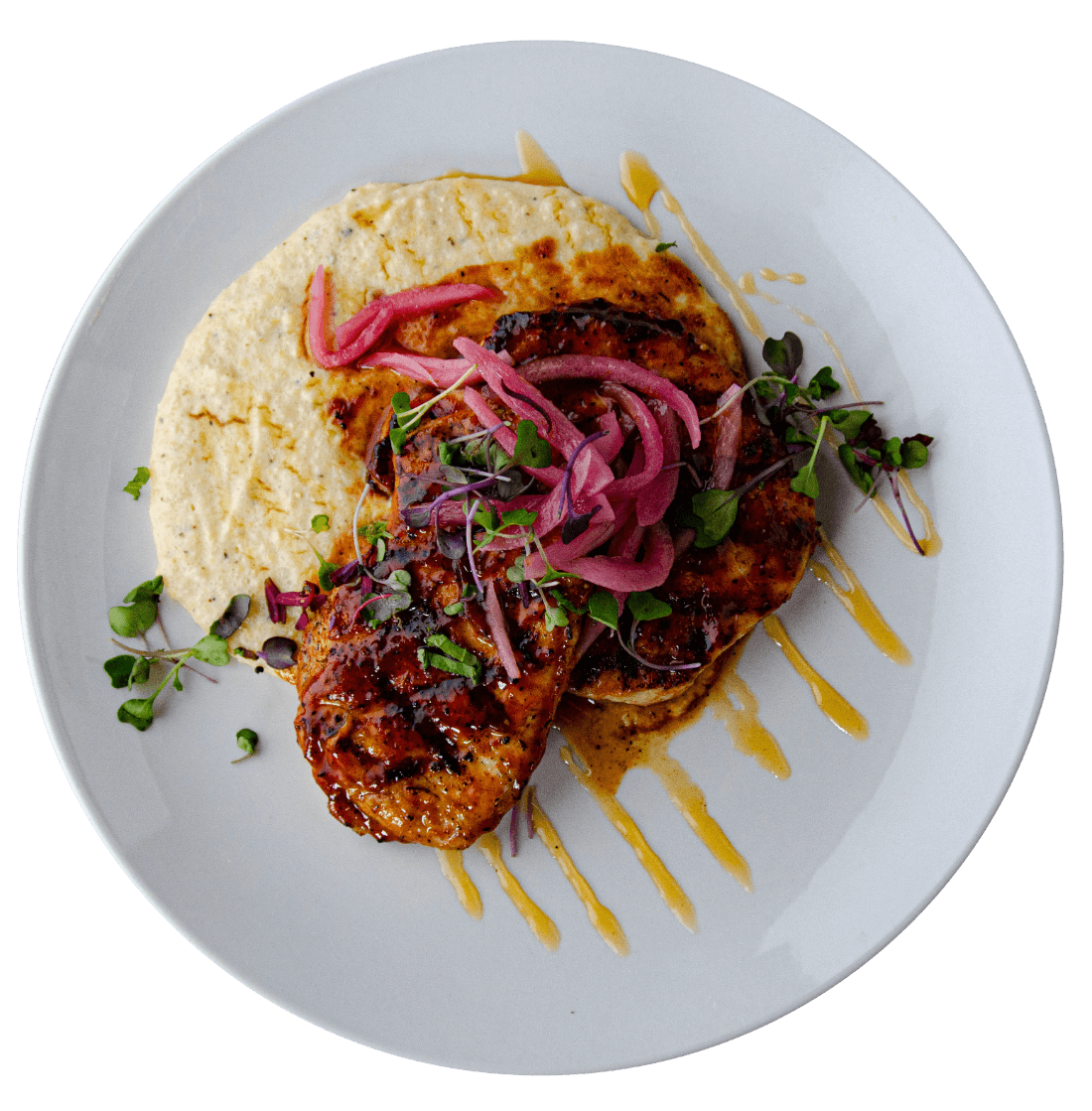grilled rustic pork chops over pimento cheese grits w/ habanero honey and house-pickled onions